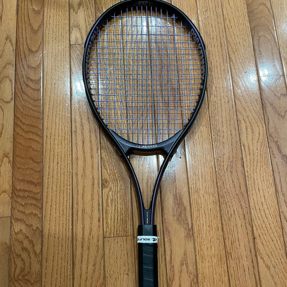 Tennis racquet with brand new strings